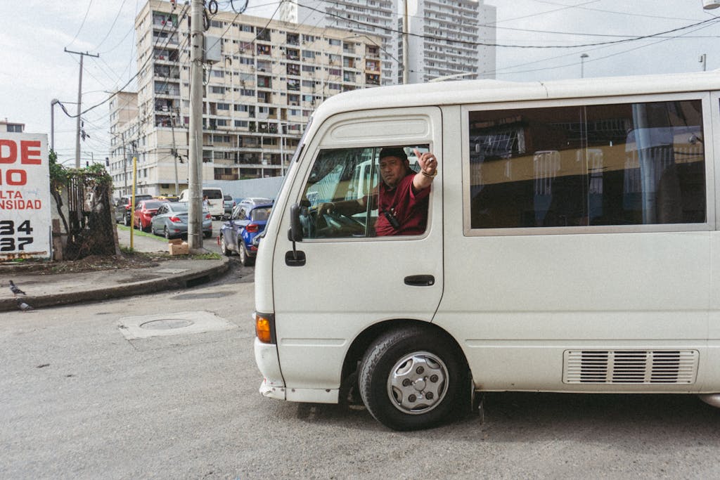 Driver with Thumb Up on Bus